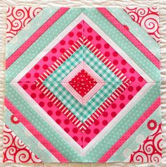 an image of a pink and green quilt with the words, what is it?