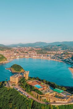 an aerial view of the beach and coastline in nice weather, with blue skies above