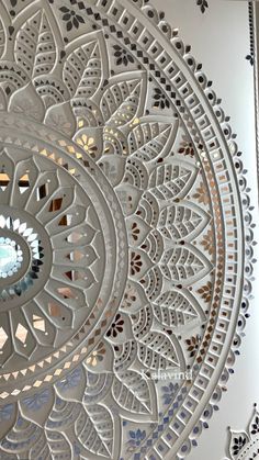 an intricately designed ceiling in the middle of a room