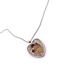 Add a unique and charming touch to your accessory collection with this original necklace by Damon Albarn and Alex James! Perfect for fans of the British band, Blur. This necklace features a heart-shaped pendant with an image of Damon and Alex, with a holographic effect glitter background. 𝗣𝗥𝗢𝗗𝗨𝗖𝗧 𝗗𝗘𝗧𝗔𝗜𝗟𝗦  ✨Unique Design: The pendant showcases a crisp image encapsulated in a heart with a glittery background that shines in the light. A unique, handmade piece.  📏Perfect Size: The pen Custom Silver Heart Necklace, Customized Silver Heart Necklace, Customized Silver Necklace For Memorial, Silver Heart-shaped Custom Necklace For Valentine's Day, Customized Silver Necklaces With Heart Pendant, Customized Silver Necklace With Heart Pendant, Heart Beads Necklace For Keepsake, Handmade Heart-shaped Keepsake Necklace, Handmade Keepsake Necklaces For Valentine's Day