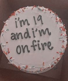 a birthday cake that says i'm 9 andim on fire with sprinkles