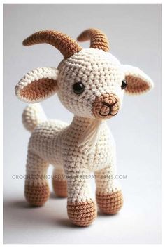 a small crocheted goat is standing up