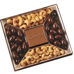 an assortment of nuts and chocolates in a gift box with a message on the side