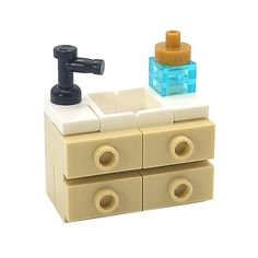 a lego bathroom sink with soap dispenser and toothbrush holder