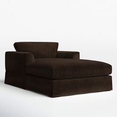 a brown couch sitting on top of a white floor