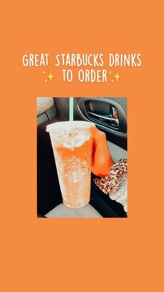 an orange starbucks drink sitting on top of a car seat