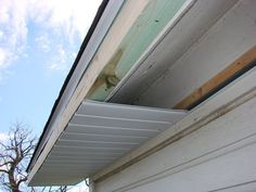 the gutter is attached to the side of the house