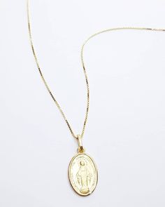 Silver plated gold Miraculous Medal Necklace. The necklace and pendants are made of 925 sterling silver plated with gold pendant size: 2.5cm (with a hook) × 1.2cm chain length: 45 cm Silver Oval Pendant Charm Necklace In Gold Plated, Gold Sterling Silver Medallion Necklace With Locket, Tarnish Resistant Oval Pendant Medallion Necklace Gift, Gold Miraculous Medal Necklace, Gold Miraculous Medal Necklace Gift, 14k Yellow Gold Necklace With Miraculous Medal, Elegant Miraculous Medal Pendant Necklace, Gold Pendant Charm Necklace With Miraculous Medal, Mary Necklace Silver