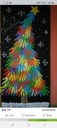 a christmas tree made out of colored crayons