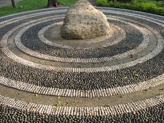 a rock sitting on top of a stone circle