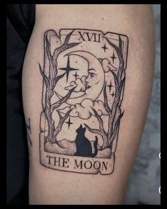 a black and white tattoo with the moon on it