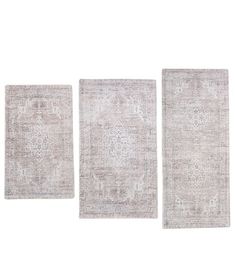 three rugs in different sizes and colors on a white background with no one else