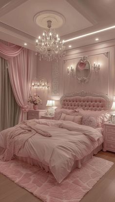 a bedroom decorated in pink and white with chandelier