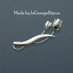 This stunning and stylistic tulip brooch, newly designed and offered to you is hand-crafted in 925 sterling silver and is 5cm in length. All our items are delivered in a presentation box and all packaging is included in the shipping. All items are sent using the French La Poste system with tracking. You will receive an email when it is shipped. Please see shipping & policies section for additional shipping information, return/exchange policy, and more. ♥ Please like our Facebook page to see our Modern Sterling Silver Brooch For Gift, Spring Jewelry, Silver Spring, Flower Pins, Solid 925 Sterling Silver, Brooch Pin, Brooches, Tulips, Patina