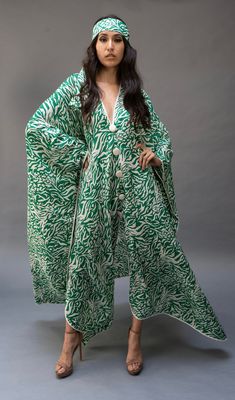 This lightweight kaftan dress  is perfect for lounging by a poolside or just to  throw on to wear all day. Festive Vacation Kaftan With Kimono Sleeves, Flowy Long Maxi Dress For Eid, Festive Green Kaftan For Vacation, Long Kimono For Beach Eid Festival, Beach-style Long Abaya For Eid, Bohemian Floor-length Kimono For Eid, Flowy Maxi-length Abaya For Eid, Long Abaya For Beach Eid Celebration, Vacation Maxi Length Thobe For Eid