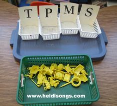 plastic trays filled with yellow objects sitting on top of a table