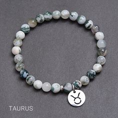 Taurus zodiac bracelet.  This beautiful Taurus Zodiac Bracelet is the perfect gift for someone with stars in their eyes! Components: ♦ Moss agate beads, 6mm  ♦ Titanium/316L Stainless steel bead and charm, no tarnish, no rust  Benefits of Titanium/316L Stainless steel: - Never fade - Medical materials - Anti-allergy MOSS AGATE * Beginnings * Prosperity * Abundance * Optimism * Self Esteem * Calming * Astrological signs: Virgo Primary Chakras: Heart, Crown Moss Agate is a stone of wealth, attract Zodiac Sign Round Beads Jewelry As Gift, Celestial Adjustable Charm Bracelet Gift, Symbolic Natural Stones Beaded Bracelets As Gift, Spiritual Zodiac Sign Bracelet Gift, Symbolic 8mm Bead Bracelet As Gift, Symbolic Round Beaded Bracelet As Gift, Symbolic Round Beaded Bracelet For Gifts, Silver Zodiac Sign Bracelet, Silver Zodiac Sign Symbolic Bracelets