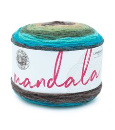 a ball of yarn that is blue, brown and white with the word mandala on it