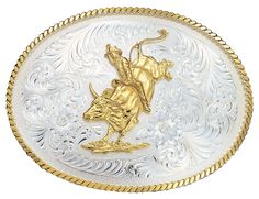 Large Silver Engraved Western Belt Buckle with Bull Rider Oval shape western belt buckle with polished gold twisted rope trim. On the silver plate, a stippling frame circles around classic western bright cut style flowers and feathers filigree engraved to perfectly fit around the large gold bull rider figure. Standard 1.5 belt swivel. 5-1/8" Wide x 4" Tall Materials: Nickel alloy base. Gold and Silver Electroplated. Montana Armor protective coating to prevent tarnish. Warranty: Buckles have a 1 Flowers And Feathers, American Bull, Bull Rider, Boots Store, Western Lifestyle, Cowboy Belt, Western Buckles, Bull Riders, Western Belt Buckles