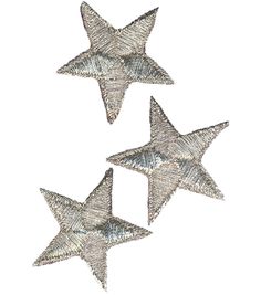 three metal stars hanging from the ceiling