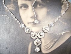 "Offering a breathtaking very high quality designer vintage Art Deco pave rhinestone link lavaliere necklace. This high-end treasure was made by \"Bogoff\" that opened its doors in early 1940 and is known for their Art Deco designs, quality material, and excellent craftsmanship. (When Bogoff jewels originally sold, they came with a life time guarantee.) The necklace features an ornate crescent moon shaped rhodium plated centerpiece encrusted with BRILLANTLY clear sparkly round cut pave set cryst Flapper Necklace, 1920s Wedding, Designer Vintage, Life Time, Rhinestone Necklace, Art Deco Design, Wedding Necklace, Vintage Art Deco, Gatsby