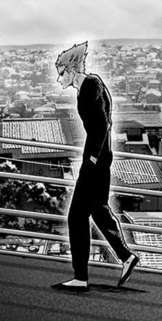 a black and white photo of a man walking down the street