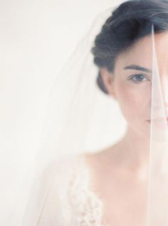 a woman wearing a veil and looking at the camera