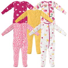 three children's pajamas with flowers and hearts on the front, one in pink, one in yellow