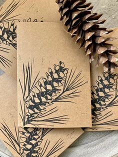 pine cones are sitting on top of brown paper