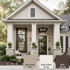 the exterior of a house with white trim and black shutters