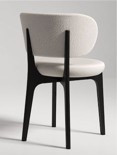 a white chair with black legs and arms