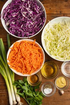 the ingredients for cabbage salad laid out in bowls