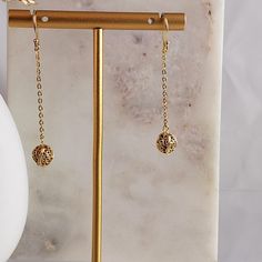 Elevate your style with our Aesthetic Long Chain Filigree Bead Drop Gold Earrings, combining elegance and minimalism in one stunning design. These threader earrings feature delicate chains and filigree bead drops crafted in 14k gold, perfect for adding a touch of sophistication to any outfit. With a width of 7 mm (1/4 inch) and a length of 52 mm (2 1/16 inches), and weighing 2 grams, they offer lightweight comfort ideal for everyday wear. An ideal gift for her or a stylish addition to your colle Dainty Delicate Chain Earrings For Party, Dainty Earrings With Delicate Chain For Party, Elegant Pierced Linear Earrings In 14k Gold Filled, Elegant 14k Gold Filled Pierced Linear Earrings, Elegant Metal Threader Earrings As Gift, Dainty Metal Earrings With Delicate Chain Detail, Dainty Metal Earrings With Delicate Chain, Delicate Chain Metal Earrings For Gifts, Delicate Chain Metal Earrings As Gift