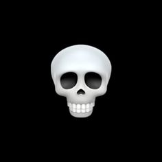 a white skull sitting on top of a black surface