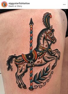 a woman's thigh with a horse tattoo on it