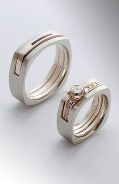 two wedding rings with diamond accents on each one, set in white and rose gold