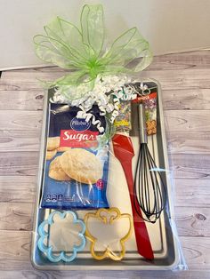 a tray with cookie ingredients and utensils in it