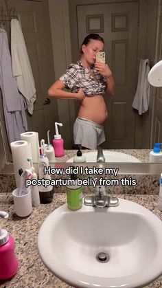 a woman taking a selfie in front of a bathroom mirror with the caption, how did i take my postparum belly from this?