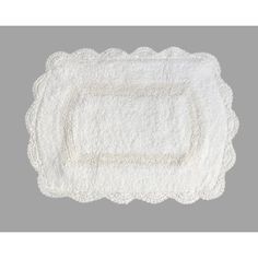 a white placemat with scalloped edges