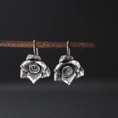 Hilltribe silver rose bud earrings Approximate dimensions; H 1 " x W 0.75" HillTribe SilverBecause of the high content of pure silver, these pieces are less likely to cause irritation to sensitive skin. This silver also tarnishes a bit slower which adds to its appeal as a low maintenance piece of jewellery. Nickel-free Sterling Silver Flower Earrings In Silver, Silver Nickel-free Flower Earrings For Anniversary, Silver Sterling Flower Earrings Hypoallergenic, Silver Flower Shaped Jewelry With Rose Design, Silver Flower Jewelry With Rose Design, Silver Floral Jewelry With Rose Design, Sterling Silver Rose Designed Rose Gold Earrings, Sterling Silver Rose Earrings With Rose Design, Sterling Silver Rose Gold Earrings With Rose Design