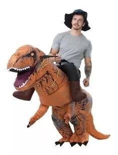 a man riding on the back of an inflatable t - rexe costume