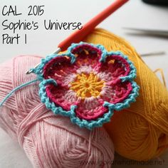 two balls of yarn and a crochet hook