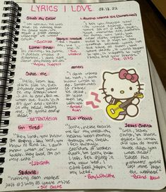 an open notebook with hello kitty writing on it