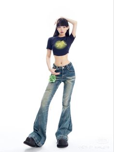 a young woman posing in jeans with her hands on her head