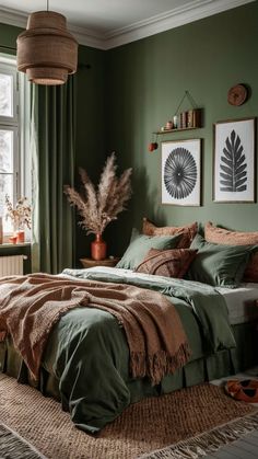 a bedroom with green walls and bedding in front of a window, rug on the floor