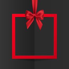 a red ribbon and bow on a black background