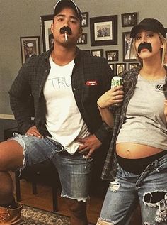 a man and woman with fake mustaches on their mouths