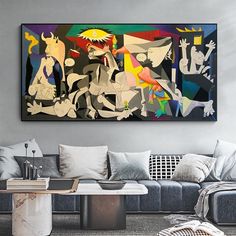 a living room with couches and paintings on the wall in it's center