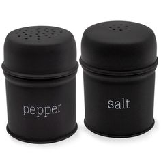 two salt and pepper shakers sitting next to each other