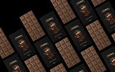 the chocolate bar packaging design has been created to look like it is made out of dark chocolate